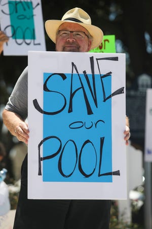 Vero Beach City Council's decision to close Leisure Square pool in January has prompted a community outcry. The council has said no decision from the budget workshops is finalized. In this July 16 photo, a Leisure Square pool supporter protests the pool's closing before the City Council meeting.