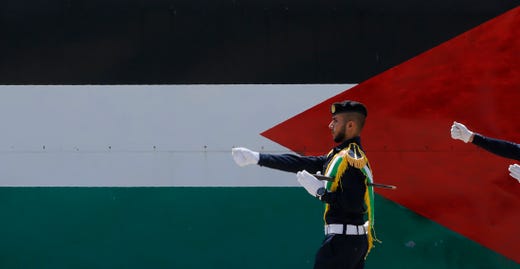 Palestinian Hamas security forces march during a graduation ceremony for 45 police officers, at Al-Rebat College Police Academy, in Gaza City on July 16, 2019.