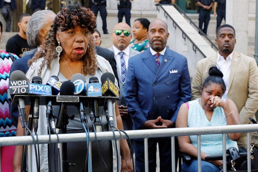 Gwen Carr, mother of chokehold victim Eric Garner, left, speaks outside the U.S. Attorney's office as Garner's widow Esaw Snipes listens at right on July 16, 2019. Federal prosecutors won't bring civil rights charges against New York City police officer Daniel Pantaleo, in the 2014 chokehold death of Garner, a decision made by Attorney General William Barr and announced one day before the five-year anniversary of his death, officials said.