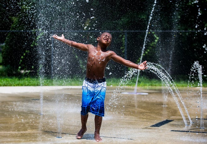 Children escape the heat at Tuhey Pool. The National Weather Service is issuing an "excessive heat watch" with the heat index expected to exceed 100 degrees Thursday through Saturday. 