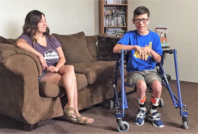 Jacob Avalos, 13, right, and his mom Claudia Avalos talk at their home in Mesilla Park on Tuesday, Jan. 16, 2019, two days before scheduled surgery to loosen Jacob's leg muscles, allowing him to have more mobility.