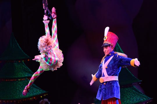 Artists perform during opening night of "Cirque Dreams Holidaze" at The Chicago Theatre on December 17, 2014.