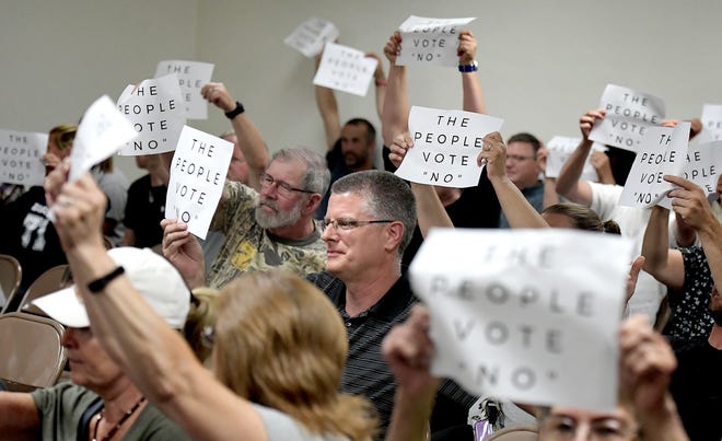 Residents make their feelings known during the North Codorus Township supervisor's vote on police services during a meeting Tuesday, July 16, 2019. The supervisors unanimously voted "yes" to employ the services Northern York County Regional Police in the township. Bill Kalina photo