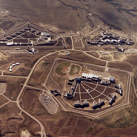 An aerial image shows Federal Correctional...