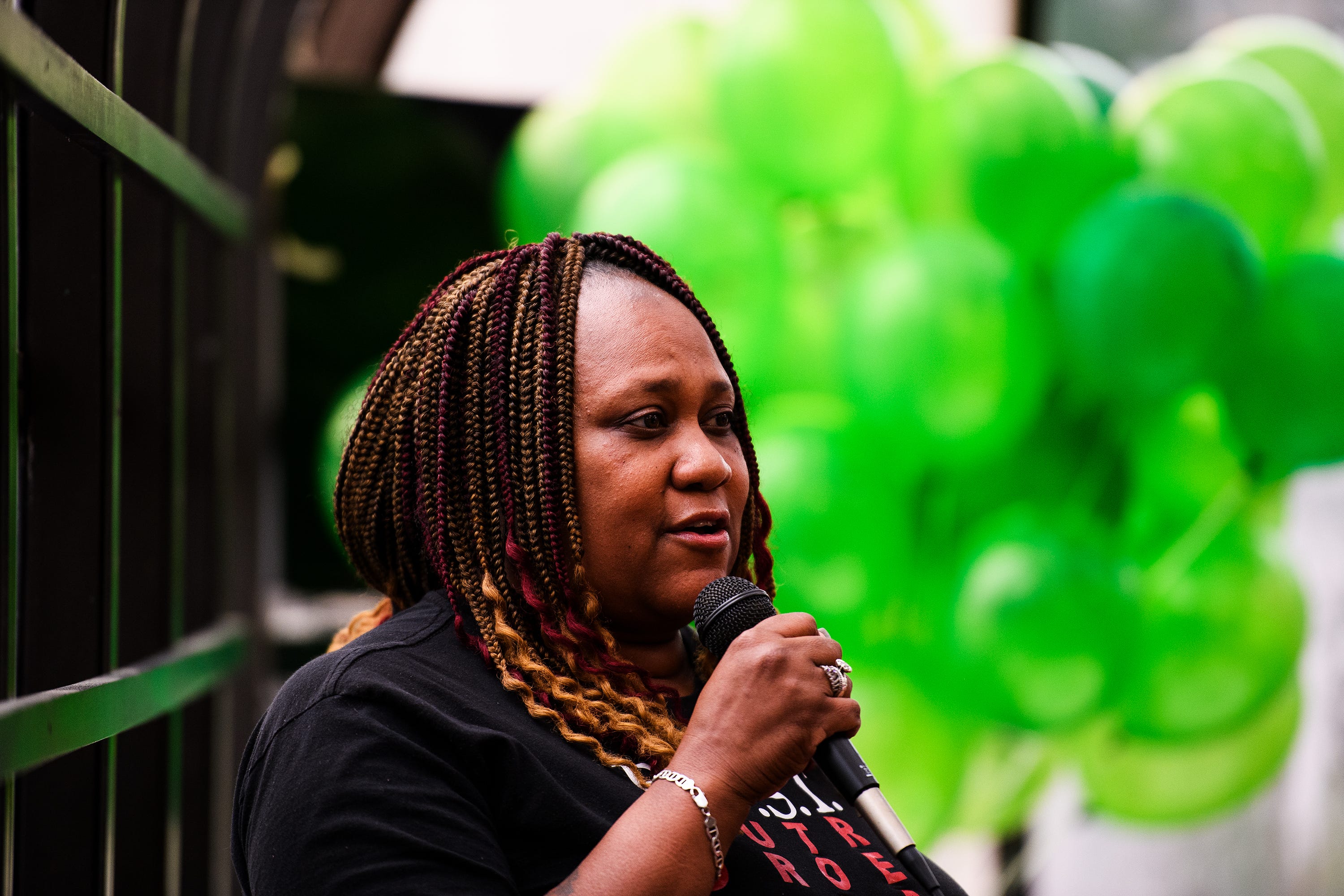 Candace Brewer speaks during a candlelight vigil honoring 16-year-old Devon Curry at the Beacon Drive-In Wednesday, July 17, 2019.