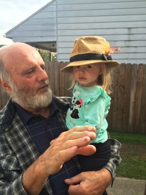 Stephen Matasic holds his grandchild, Berlin, before having a stroke he never recovered from.