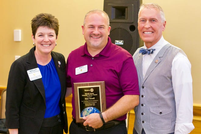 Matt Howell (center), 2019 recipient of the Merrill Greene Award, poses with current Muncie Rotary president Kelly Shrock (at left) and  Dale Basham, immediate-past District 6560 governor.