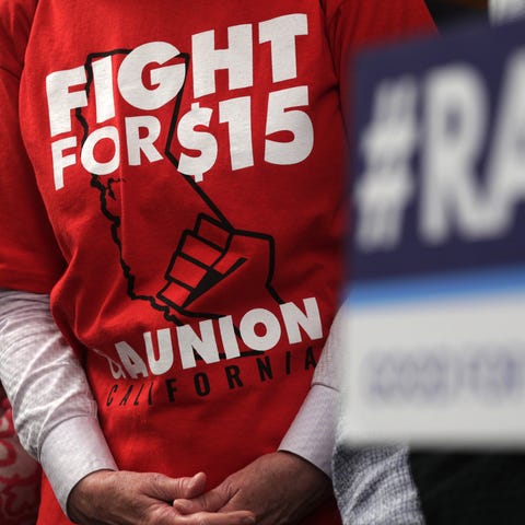 An activist wears a "Fight For $15" T-shirt during