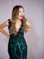 Kathy Zhu, a 20-year-old senior at the University of Michigan, says she was barred from a beauty pageant over "insensitive" tweets.