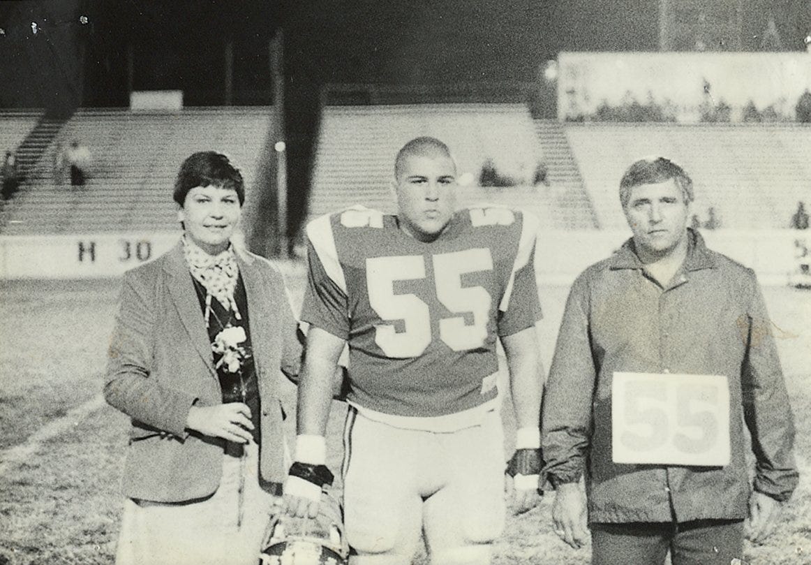Margaret Sirianni, left, celebrates her husband, Fort Myers High School varsity football coach, Sam Sirianni Sr.'s, right,100th victory with their son, Sam Jr., in 1981.