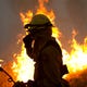 A firefighter helps ignite a controlled burn in an attempt to halt the Camp Fire in Butte County on Nov. 14, 2018.