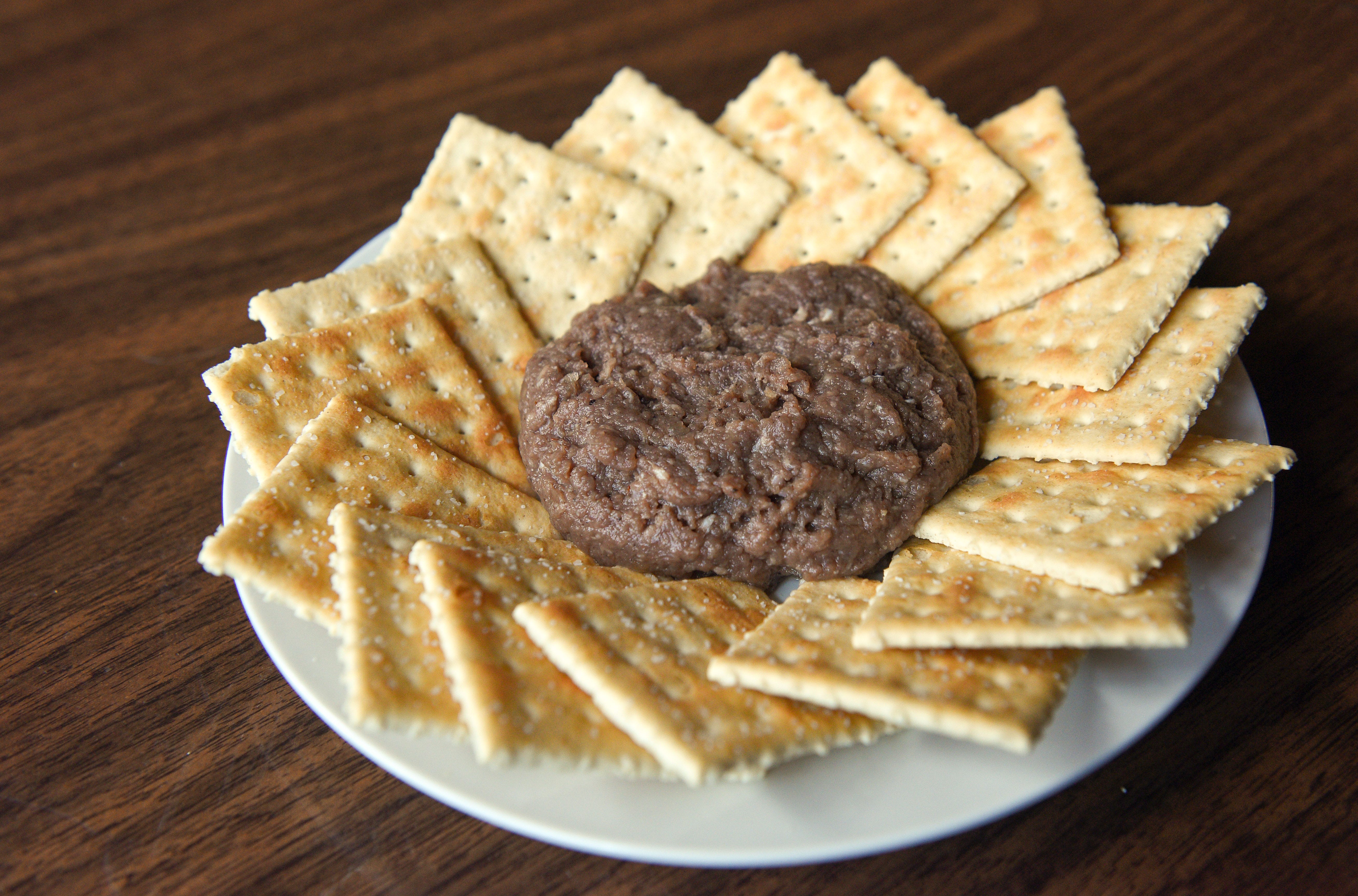 Tiger meat: Raw hamburger seasoned and cured, eaten like a dip with crackers. Commonly referred to as