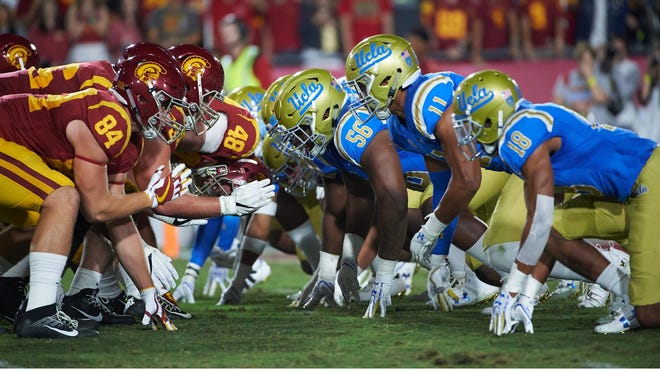 Greg Rogers (56) lines up against USC during the 2017 season.
