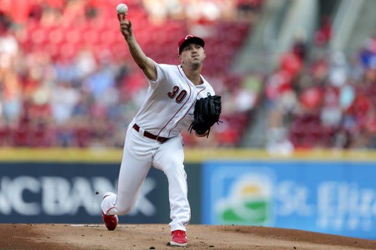 Cincinnati Reds starting pitcher Tyler Mahle delivers in the first inning against the St. Louis Cardinals in their MLB baseball game on Friday, July 19, 2019, at Great American Ball Park in Cincinnati.