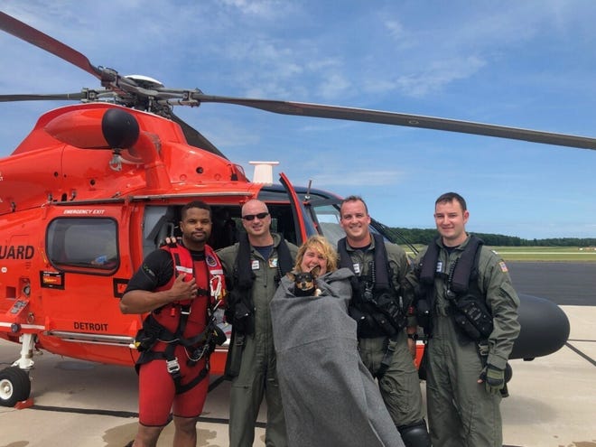 U.S. Coast Guard Air Facility Muskegon's MH-65 Dolphin helicopter crew rescued the pair on Friday.