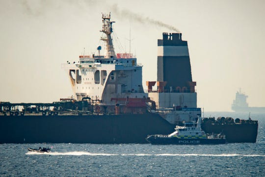 A Royal Marine patrol vessel is seen beside the Grace 1 super tanker in the British territory of Gibraltar on July 4, 2019.