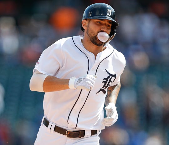 Tigers designated hitter Nicholas Castellanos blows a bubble as he rounds the bases after hitting a solo walk off home run during the 10th inning of the Tigers' 4-3 win in 10 innings on Sunday, July 21, 2019, at Comerica Park.