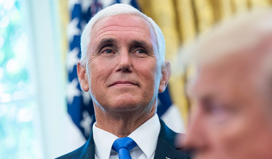 Vice President Mike Pence listens as President Donald Trump  welcomes astronauts Buzz Aldrin, Michael Collins, and the family of Neil Armstrong to the   Oval Office of the White House in Washington,  July 18, 2019.
