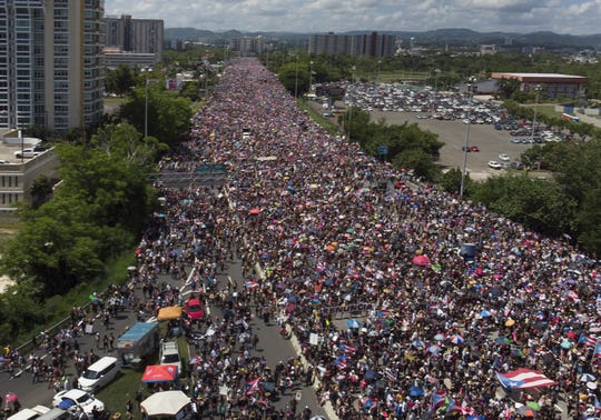An aerial view from a drone shows thousands of people as they fill the Expreso Las Américas highway.