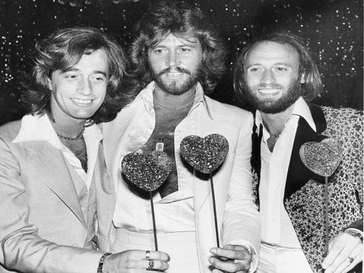 **FILE**The Bee Gees, from left, Robin, Barry and Maurice Gibb, attend a party following the Hollywood premiere of "Sgt. Pepper's Lonely Hearts Club Band" in this July 31, 1978 file photo. Maurice Gibb died Sunday, Jan. 12, 2003 at a Miami Beach, Fla. hospital, his family said. He was 53. (AP Photo/Lennox McLendon) ORG XMIT: NY8