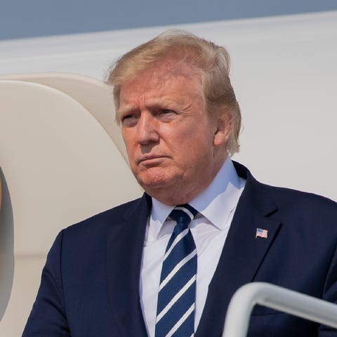 President Donald Trump disembarks Air Force One...
