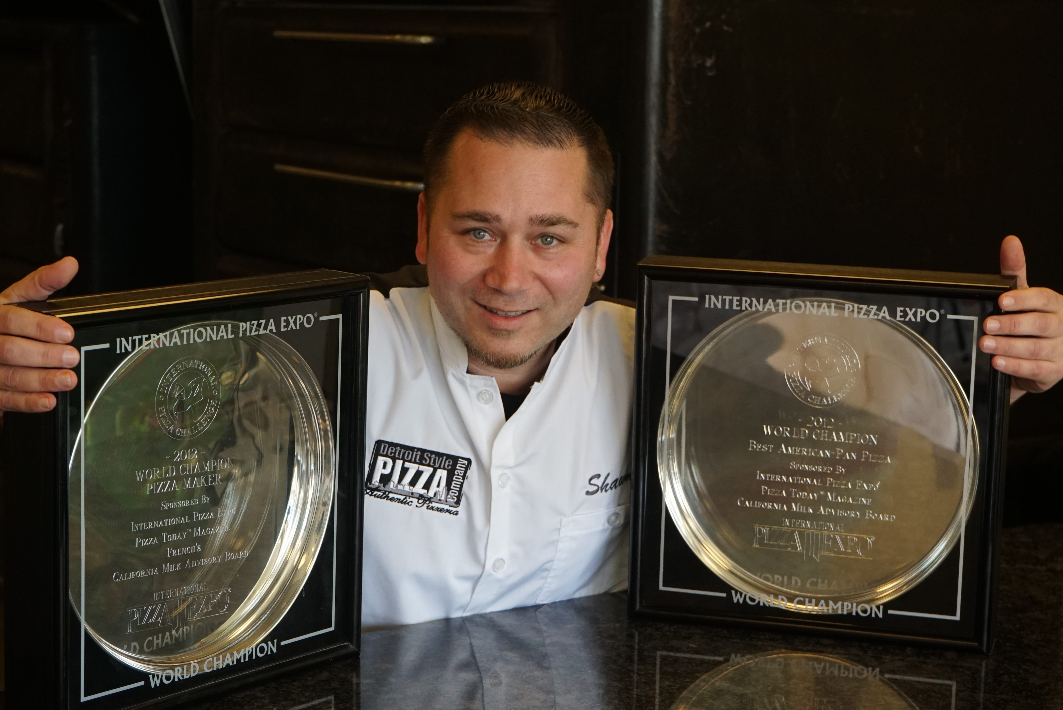 Shawn Randazzo of Detroit Style Pizza Company with his World Pizza Maker champion trophies.