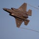 A F-35 Lightning flies above during the EAA AirVenture air show on Monday, July 22, 2019, at Wittman Regional Airport in Oshkosh, Wis.