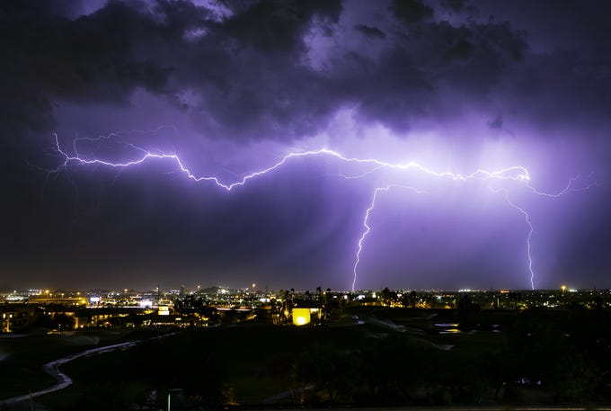 Lightning strikes over the East Valley as a monsoon storm approaches Phoenix on July 22, 2019.