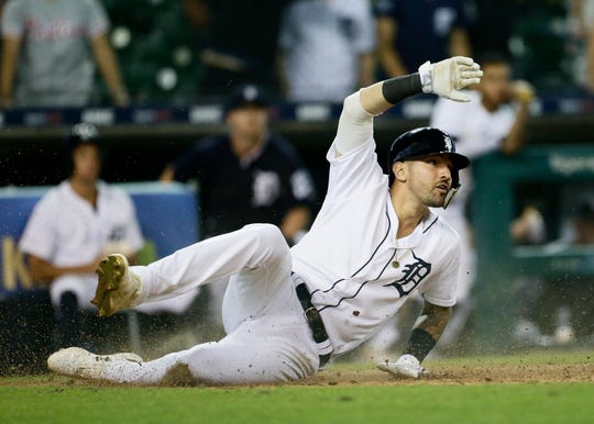 Tigers right fielder Nicholas Castellanos looks to the home plate umpire after trying to score from second base on a single by Brandon Dixon during the 14th inning of the Tigers' 3-2 loss to the Phillies on Tuesday, July 24, 2019, at Comerica Park.