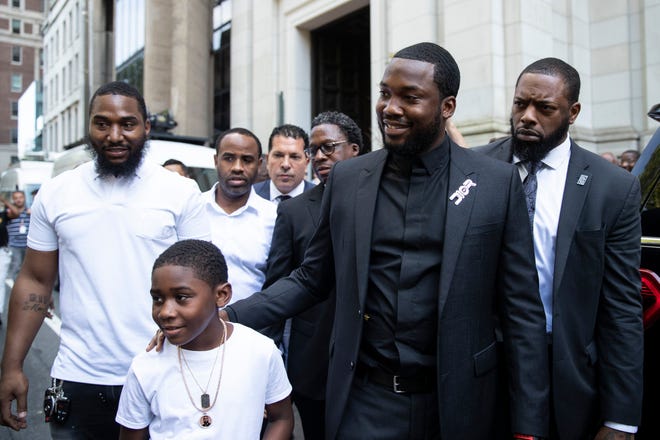 Rapper Meek Mill departs with his son Rihmeek "Papi" Williams after a hearing at a Pennsylvania appeals court in Philadelphia, Tuesday, July 16, 2019.