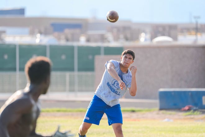 Junior quarterback, Marcos Lopez, practices at the Las Cruces High School football practice field in Las Cruces on Wednesday, July 24, 2019.
