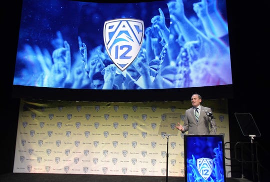 Pac-12 Commissioner Larry Scott speaks during Pac-12 football media day at Hollywood & Highland.