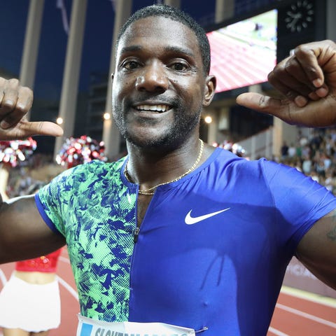 Justin Gatlin celebrates after winning in the...