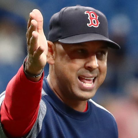 Red Sox manager Alex Cora questions umpires about...