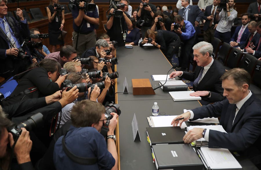 Former Special Counsel Robert Mueller, left, and former Deputy Special Counsel Aaron Zebley arrive to testify before the House Intelligence Committee.
