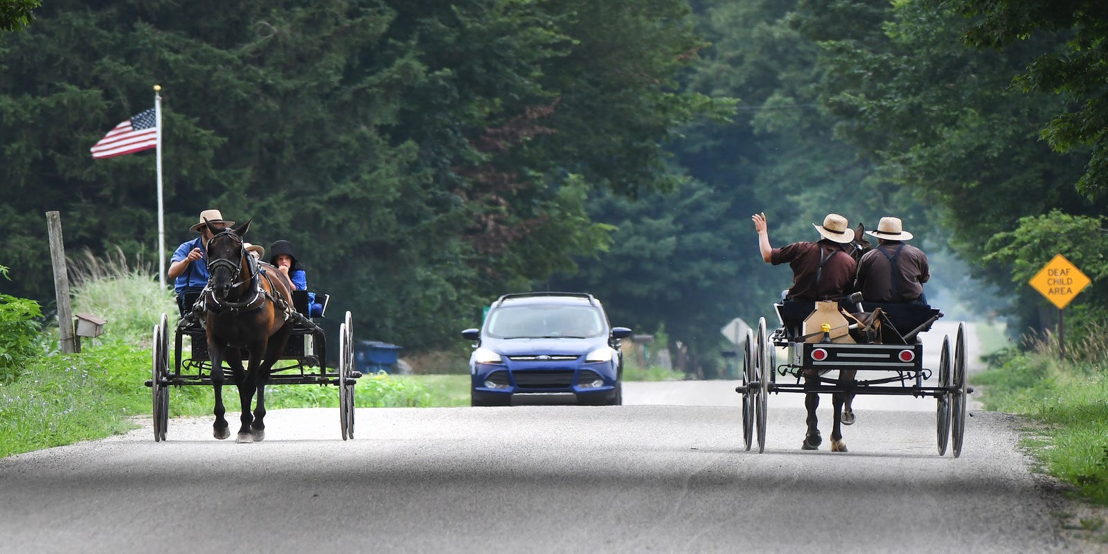 When Worlds Collide Amish Buggies Heavy Vehicles Meet With