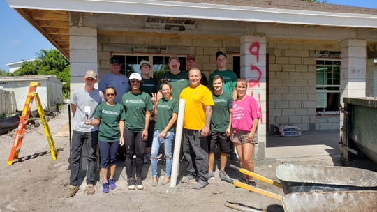 Employees of Caler, Donten, Levine, Cohen, Porter & Veil, P.A. in Stuart recently participated in a home build for Habitat for Humanity of Martin County. Volunteers from the CPA firm painted, installed windows and removed debris at the construction site. The volunteer team included, from left, back row, Jeff Platt, Nancy Gray, Martin Woods, Rick Gray, and Dustin Provenzano; front row, Daniel Boring, Cherry Meola, Anna Knox, Yinett Florentino, Juan Caban, Luke Mellone and Nancy Prywitowski.