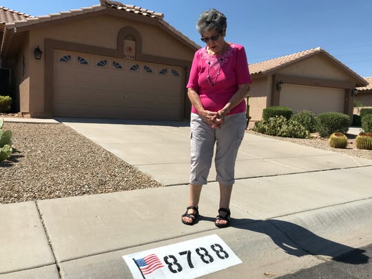 Donna Cordero, 82, of Peoria is fighting the Westbrook Village Homeowner's Association's order to paint over the American flag displayed on her curb.