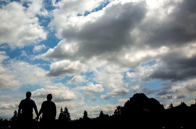 The parents of an adult son who has attempted suicide, but refuses mental health treatment, take time out for a walk through a Salem park on July 7, 2019.