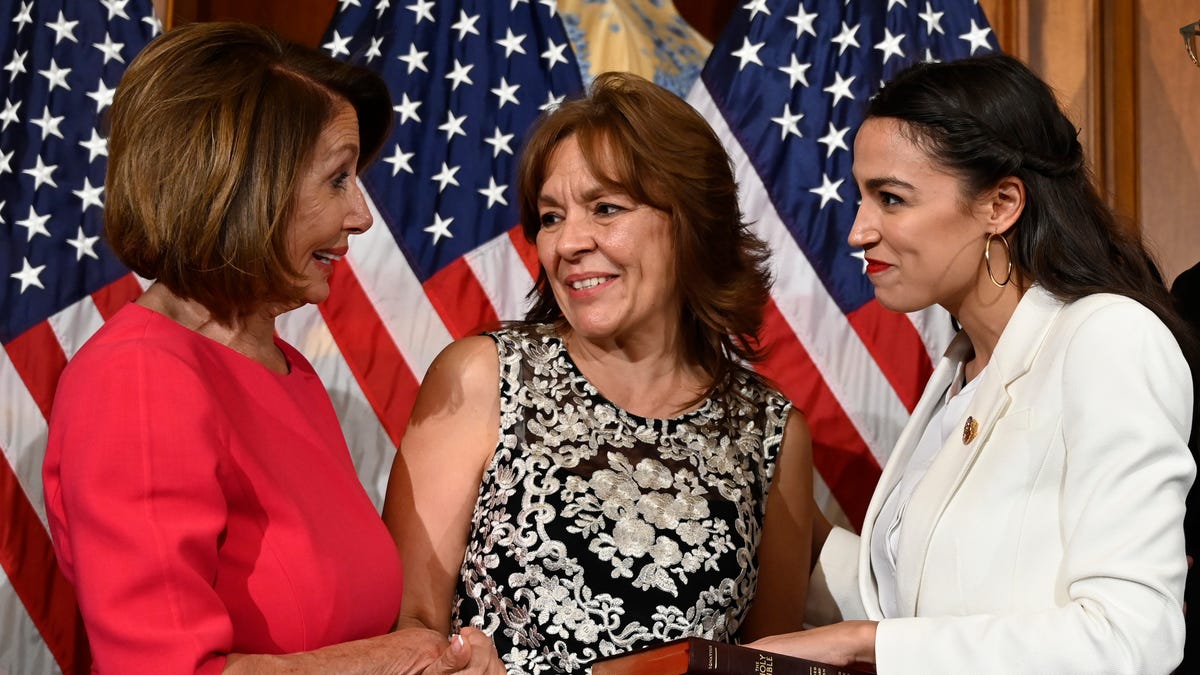 House Speaker Nancy Pelosi of Calif., left, talks with Rep. Alexandria Ocasio-Cortez, D-N.Y., right, and her mother Blanca Ocasio-Cortez, center, during a ceremonial swearing-in on Capitol Hill in Washington, Thursday, Jan. 3, 2019, during the opening session of the 116th Congress.