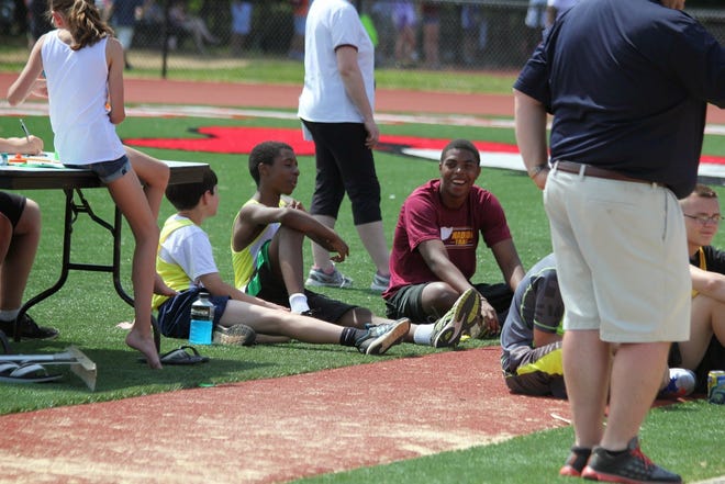 R.J. Graddy volunteered with the Madison youth track and field program.