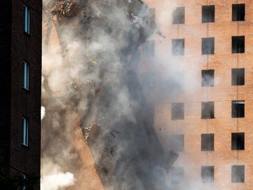   Carmichael West Tower 3 falls under an implosion in Nashville, Tennessee, Saturday, July 27, 2019. 