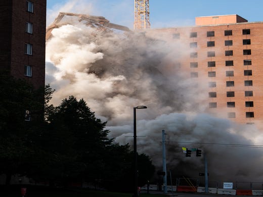  Carmichael West Tower 3 falls d uring an implosion in Nashville, Tenn., Saturday, July 27, 2019. 