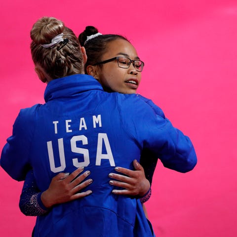 Morgan Hurd of the U.S. gets a hug from a coach af