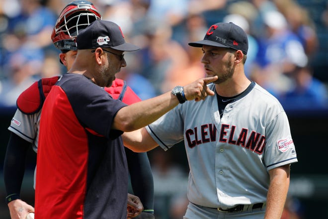 Indians manager Terry Francona, left, has words with pitcher Trevor Bauer, right, as Bauer is taken out in the fifth inning on Sunday.