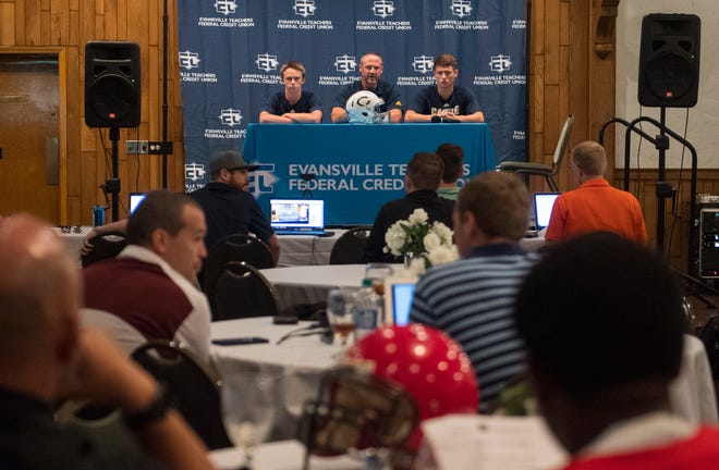 Castle's Head Coach Doug Hurt, center, answers questions about the upcoming season during High School Football Media Day 2019 Monday, July 29, 2019.