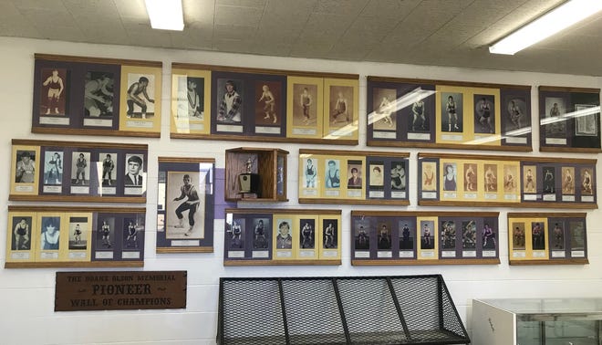 The Duane Olson Memorial Wall of Champions, dedicated to the Pioneer wrestling champions, sits inside the entrance to the Big Sandy High School gym.