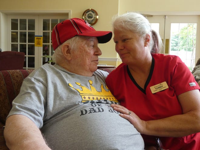 Carl Breece Sr., left, and daughter Tammy Zaworski, right, at the Memory Care day care at Kingston Residence of Marion. Breece, who has dementia, usually attends the day care four days a week, where Zaworski works as a cook.