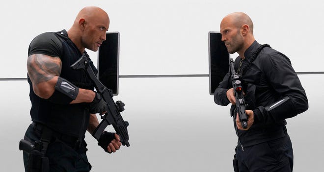 Dwayne Johnson, left, and Jason Statham star in "Fast & Furious Presents: Hobbs & Shaw." The movie opens Thursday at Regal West Manchester, Frank Theatres Queensgate Stadium 13 and R/C Hanover Movies.