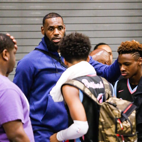 LeBron James and his son LeBron James Jr. after a...